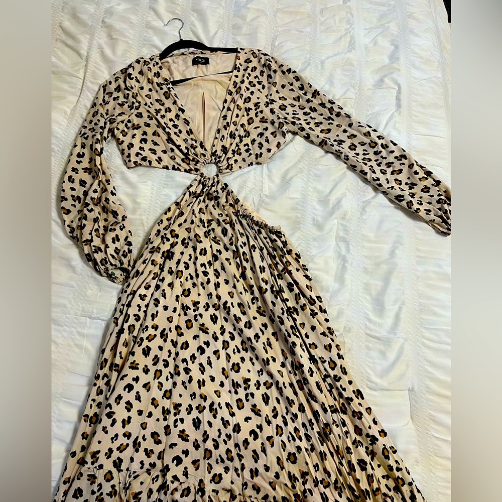 VICI leopard print maxi dress. Long sleeve. With cutout on sides.Never been worn